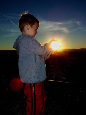 BOY Holding the sun